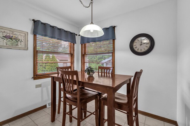 9226 S Utica Ave, Evergreen Park, IL 60805 - dining area featuring baseboards and light tile patterned flooring