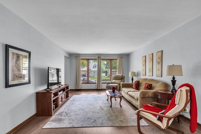 9226 S Utica Ave, Evergreen Park, IL 60805 - living room featuring baseboards and wood finished floors