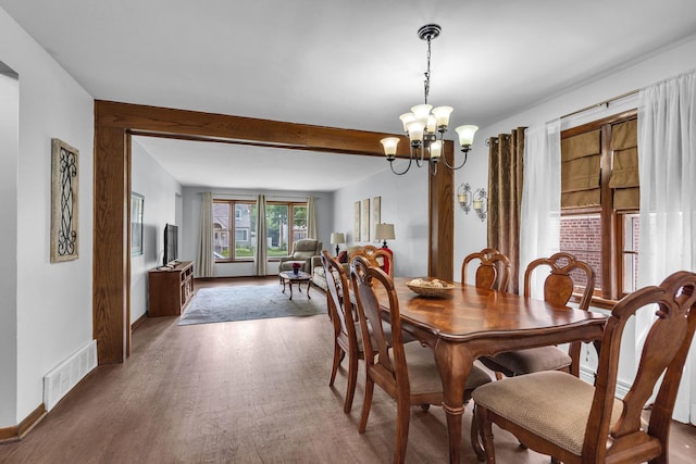9226 S Utica Ave, Evergreen Park, IL 60805 - dining area with a chandelier, wood finished floors, and beamed ceiling