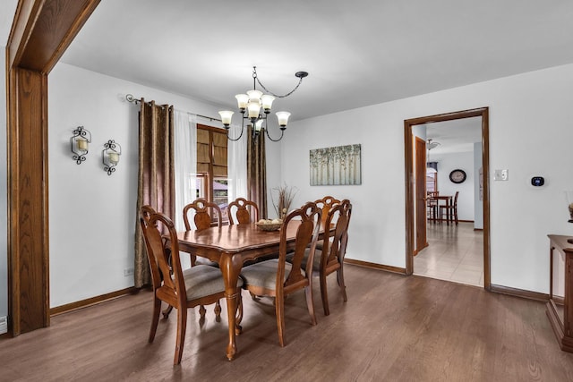 9226 S Utica Ave, Evergreen Park, IL 60805 - dining space featuring a chandelier and dark wood-type flooring