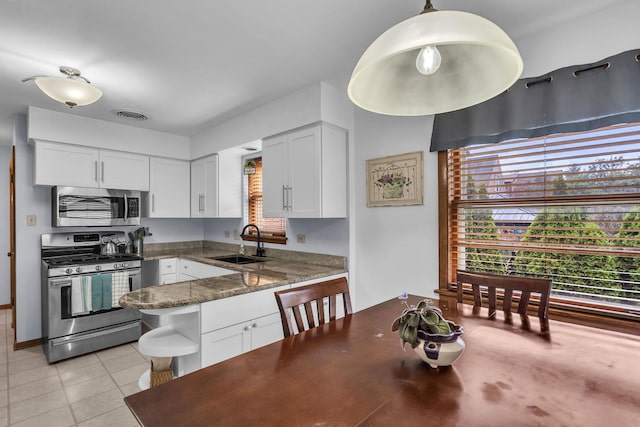 9226 S Utica Ave, Evergreen Park, IL 60805 - kitchen featuring appliances with stainless steel finishes, white cabinets, open shelves, and light tile patterned floors