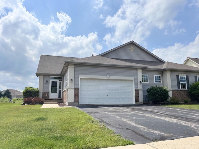 913 Yorktown St, Mchenry, IL 60050 - ranch-style home featuring brick siding, driveway, an attached garage, a front lawn, and roof with shingles