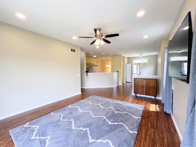 913 Yorktown St, Mchenry, IL 60050 - unfurnished living room with dark wood finished floors, ceiling fan, and recessed lighting