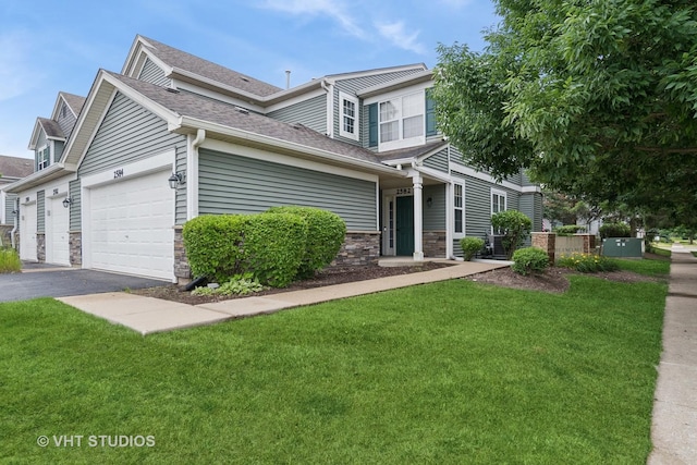 2582 Golf Ridge Cir, Naperville, IL 60563 - view of front of property featuring a front lawn, asphalt driveway, a garage, stone siding, and roof with shingles