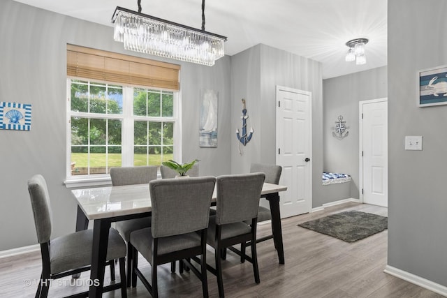 2582 Golf Ridge Cir, Naperville, IL 60563 - dining room featuring a chandelier and wood finished floors