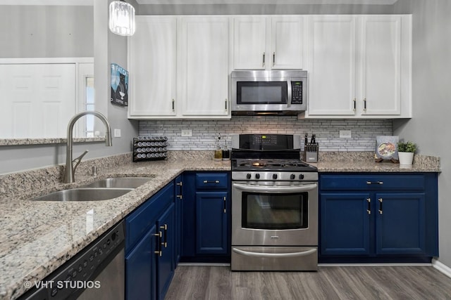 2582 Golf Ridge Cir, Naperville, IL 60563 - kitchen with appliances with stainless steel finishes, blue cabinetry, white cabinetry, and wood finished floors