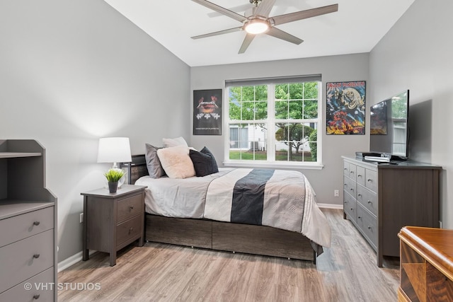 2582 Golf Ridge Cir, Naperville, IL 60563 - bedroom featuring light wood-style flooring, vaulted ceiling, and a ceiling fan