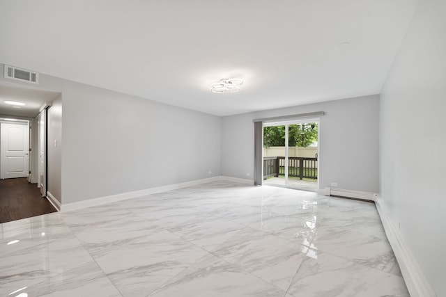 8232 Niles Center Rd Unit 101, Skokie, IL 60077 - empty room with marble finish flooring and a baseboard radiator