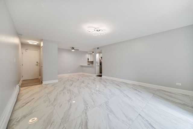 8232 Niles Center Rd Unit 101, Skokie, IL 60077 - unfurnished living room featuring light marble finish floors and a baseboard heating unit