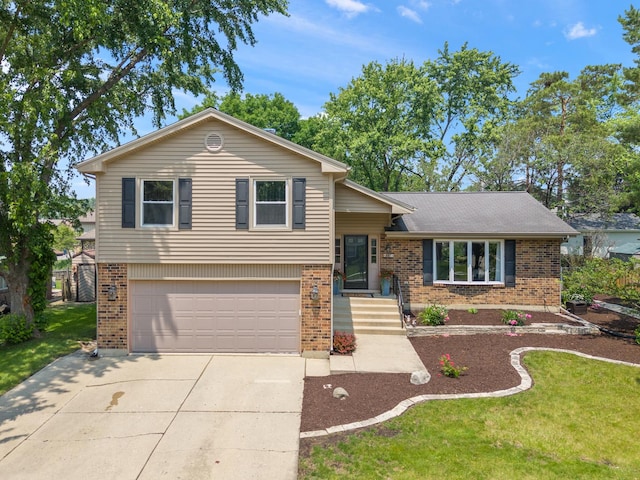 647 Farnham Ln, Wheaton, IL 60189 - split level home with brick siding, an attached garage, driveway, and a front yard
