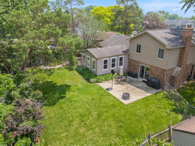 647 Farnham Ln, Wheaton, IL 60189 - back of property with a patio area, brick siding, and a fire pit