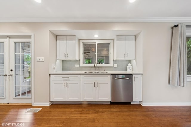 647 Farnham Ln, Wheaton, IL 60189 - kitchen featuring stainless steel dishwasher, dark wood-style flooring, tasteful backsplash, ornamental molding, and white cabinets