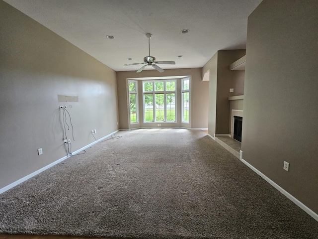 210 Barrington Dr, Bourbonnais, IL 60914 - unfurnished living room with a ceiling fan, carpet flooring, a fireplace with raised hearth, and recessed lighting