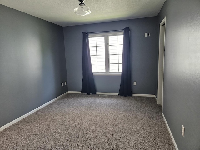 210 Barrington Dr, Bourbonnais, IL 60914 - carpeted empty room featuring a textured ceiling and baseboards