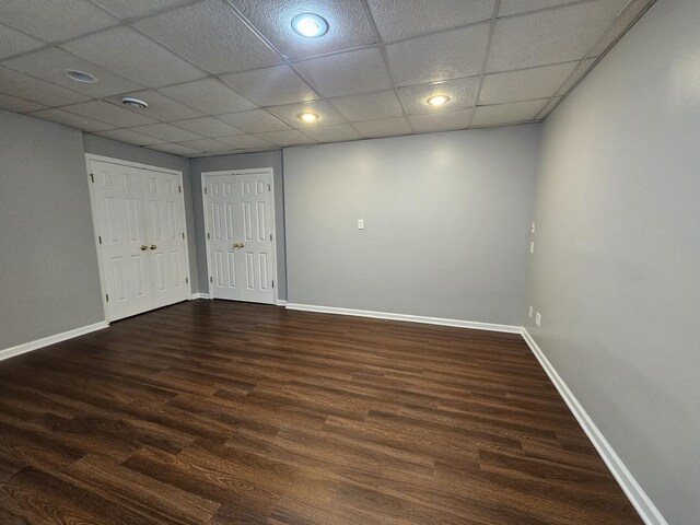 210 Barrington Dr, Bourbonnais, IL 60914 - unfurnished bedroom featuring dark wood-style flooring, two closets, recessed lighting, and a paneled ceiling