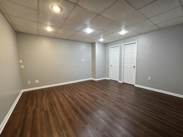 210 Barrington Dr, Bourbonnais, IL 60914 - spare room featuring dark wood-style floors and a paneled ceiling