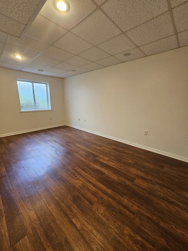 210 Barrington Dr, Bourbonnais, IL 60914 - empty room featuring dark wood-style floors and a paneled ceiling