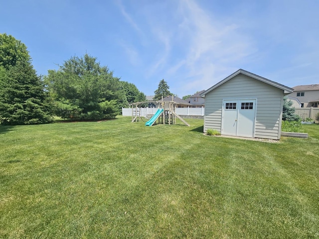 210 Barrington Dr, Bourbonnais, IL 60914 - view of yard featuring a playground and a storage shed