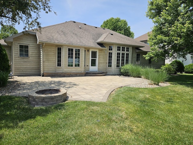 210 Barrington Dr, Bourbonnais, IL 60914 - back of property featuring a fire pit, a patio area, a lawn, and roof with shingles