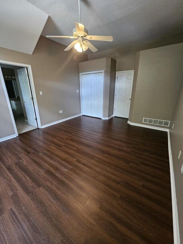 210 Barrington Dr, Bourbonnais, IL 60914 - spare room featuring dark wood-type flooring, a ceiling fan, and a textured ceiling