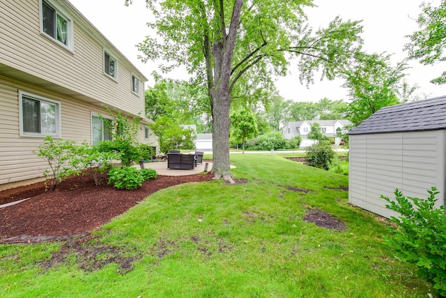 552 Arbor Gate Ln, Buffalo Grove, IL 60089 - view of grassy yard featuring a patio area and a storage unit