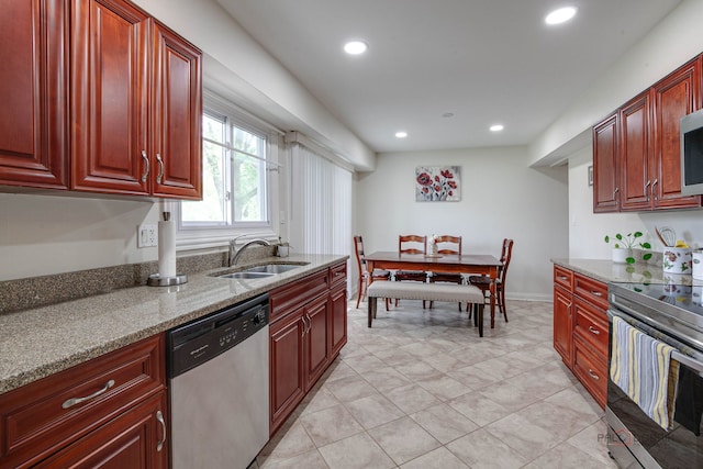 552 Arbor Gate Ln, Buffalo Grove, IL 60089 - kitchen featuring stainless steel appliances, dark brown cabinets, light stone counters, recessed lighting, and light tile patterned floors