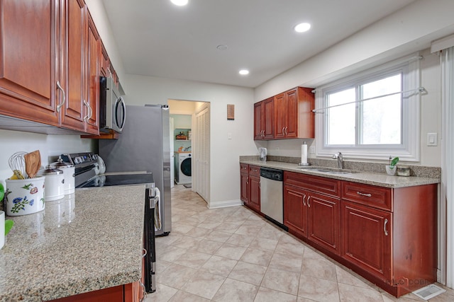 552 Arbor Gate Ln, Buffalo Grove, IL 60089 - kitchen featuring appliances with stainless steel finishes, washer / dryer, recessed lighting, and light tile patterned floors