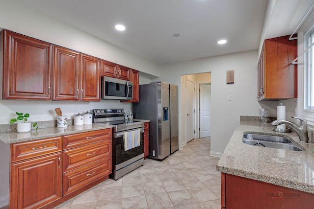 552 Arbor Gate Ln, Buffalo Grove, IL 60089 - kitchen featuring stainless steel appliances, recessed lighting, light tile patterned flooring, and light stone counters