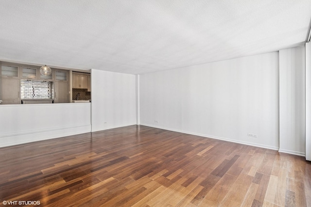 230 E Ontario St Unit 2305, Chicago, IL 60611 - unfurnished living room featuring wood finished floors and a textured ceiling