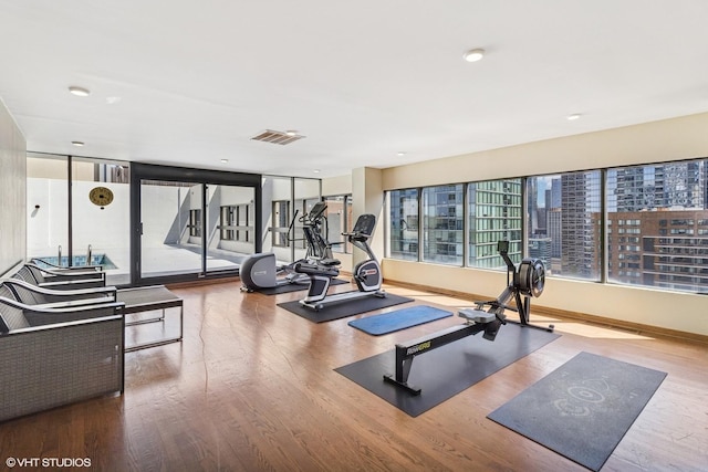 230 E Ontario St Unit 2305, Chicago, IL 60611 - exercise room featuring wood finished floors and baseboards