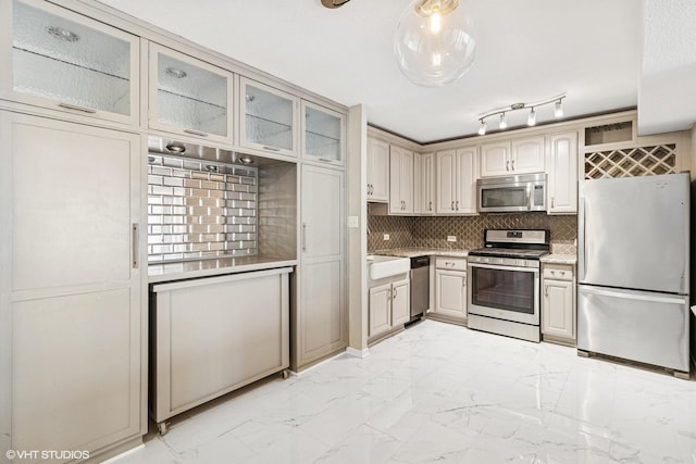 230 E Ontario St Unit 2305, Chicago, IL 60611 - kitchen with stainless steel appliances, light marble finish flooring, light countertops, glass insert cabinets, and backsplash