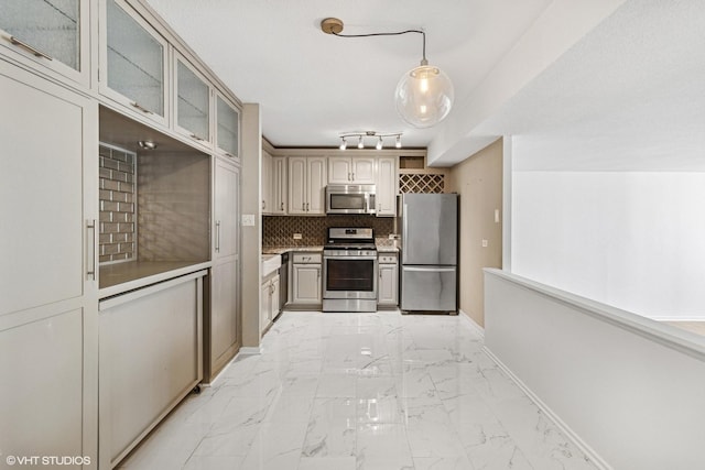 230 E Ontario St Unit 2305, Chicago, IL 60611 - kitchen featuring stainless steel appliances, light marble finish flooring, tasteful backsplash, glass insert cabinets, and light countertops