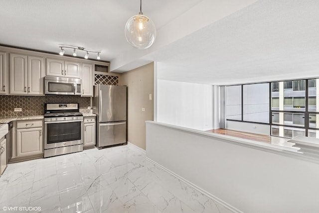 230 E Ontario St Unit 2305, Chicago, IL 60611 - kitchen with stainless steel appliances, light marble finish flooring, decorative backsplash, decorative light fixtures, and light stone counters