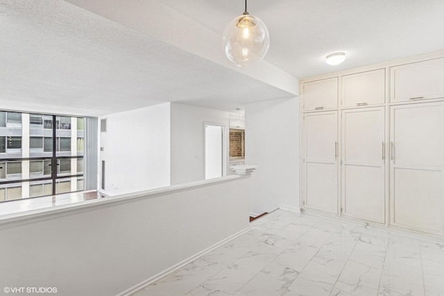 230 E Ontario St Unit 2305, Chicago, IL 60611 - unfurnished dining area with light marble finish floors and a textured ceiling
