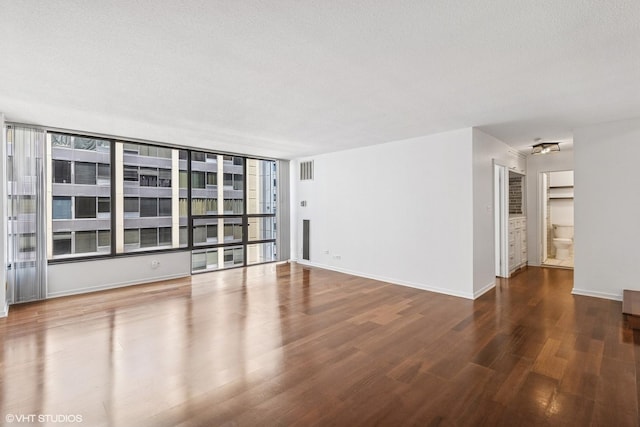 230 E Ontario St Unit 2305, Chicago, IL 60611 - spare room featuring wood finished floors and baseboards