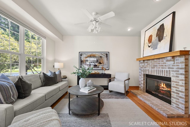 1962 Highbury Ln, Aurora, IL 60502 - living room with a brick fireplace, ceiling fan, wood finished floors, and recessed lighting