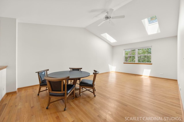 1962 Highbury Ln, Aurora, IL 60502 - dining room featuring a skylight, wood finished floors, vaulted ceiling, and ceiling fan