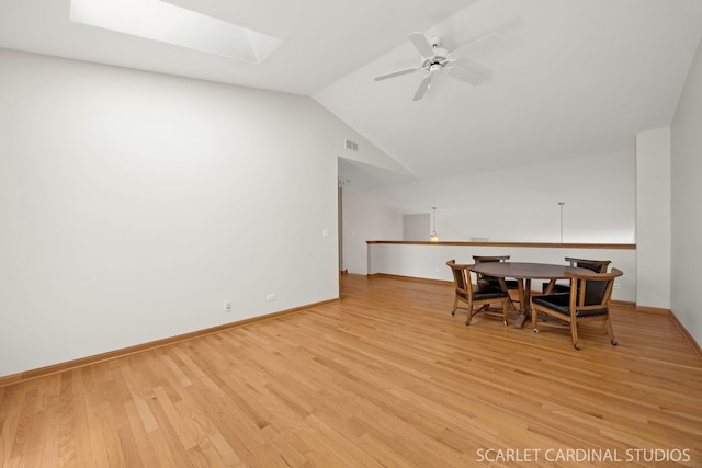 1962 Highbury Ln, Aurora, IL 60502 - dining room featuring a skylight, light wood-type flooring, a ceiling fan, and vaulted ceiling