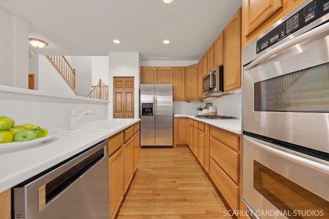 1962 Highbury Ln, Aurora, IL 60502 - kitchen with stainless steel appliances, light wood-type flooring, light countertops, and recessed lighting