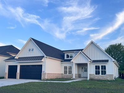 25136 Thornberry Dr Unit 25136, Plainfield, IL 60544 - modern inspired farmhouse featuring board and batten siding, a front lawn, a garage, and driveway