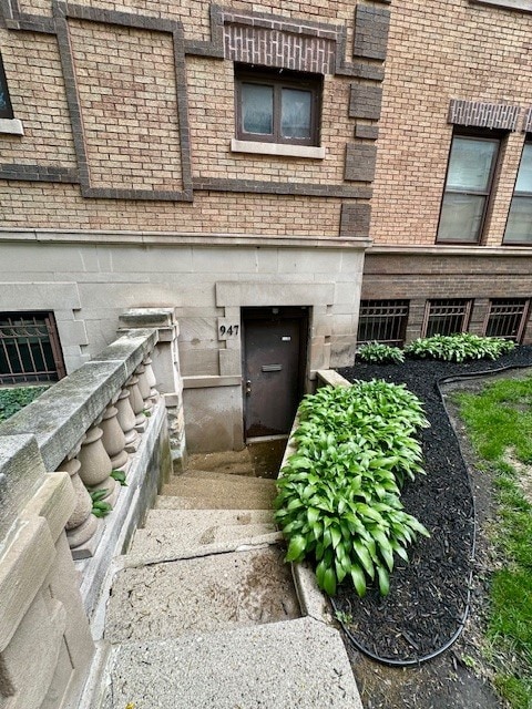 947 E Hyde Park Blvd Unit G, Chicago, IL 60615 - doorway to property featuring brick siding