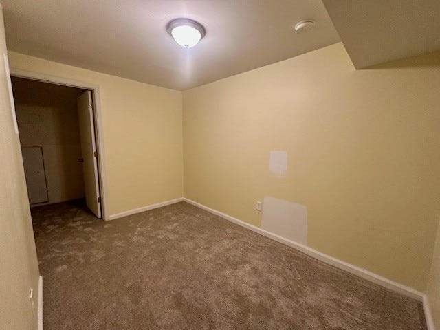 947 E Hyde Park Blvd Unit G, Chicago, IL 60615 - carpeted spare room with a smoke detector and baseboards
