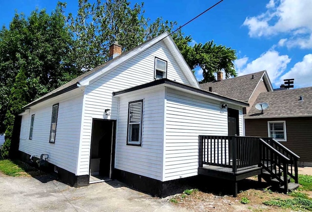 rear view of house with a chimney
