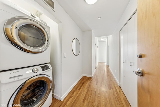 1720 S Michigan Ave Unit 2106, Chicago, IL 60616 - laundry room featuring stacked washer / dryer and light wood finished floors