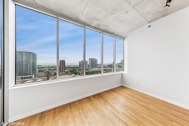 1720 S Michigan Ave Unit 2106, Chicago, IL 60616 - unfurnished room with a view of city and wood finished floors