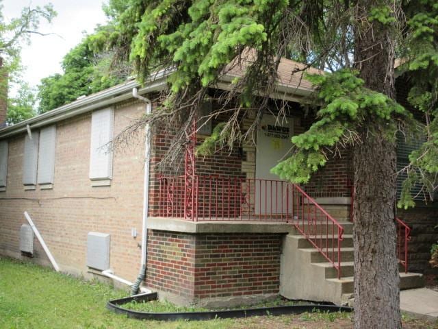 7700 S Ada St, Chicago, IL 60620 - view of side of home with brick siding and stairway