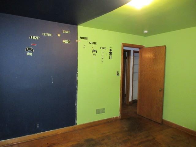 7700 S Ada St, Chicago, IL 60620 - unfurnished bedroom with baseboards and wood finished floors