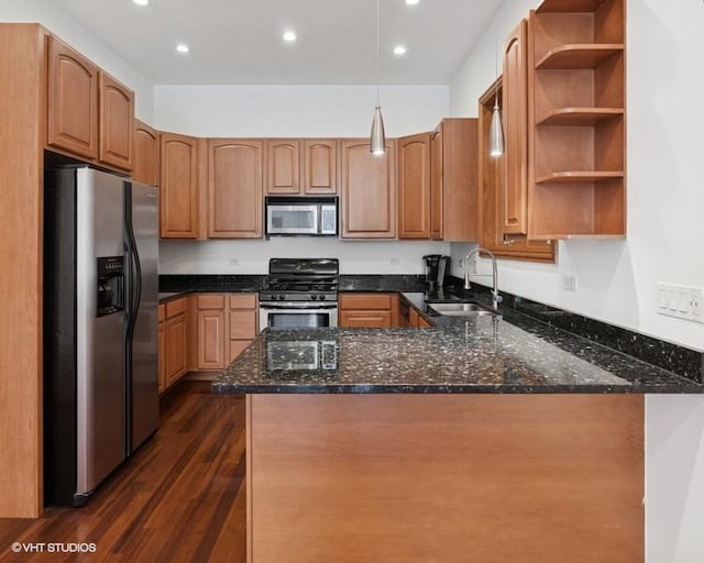 1644 W Lemoyne St Unit 1, Chicago, IL 60622 - kitchen featuring appliances with stainless steel finishes, a peninsula, dark stone counters, dark wood-type flooring, and recessed lighting
