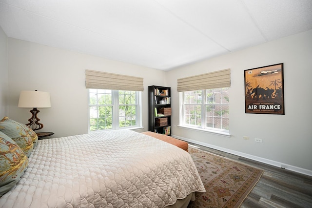 570 Crescent Blvd Unit 307, Glen Ellyn, IL 60137 - bedroom with wood finished floors and baseboards