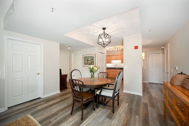 570 Crescent Blvd Unit 307, Glen Ellyn, IL 60137 - dining space featuring dark wood finished floors and a chandelier